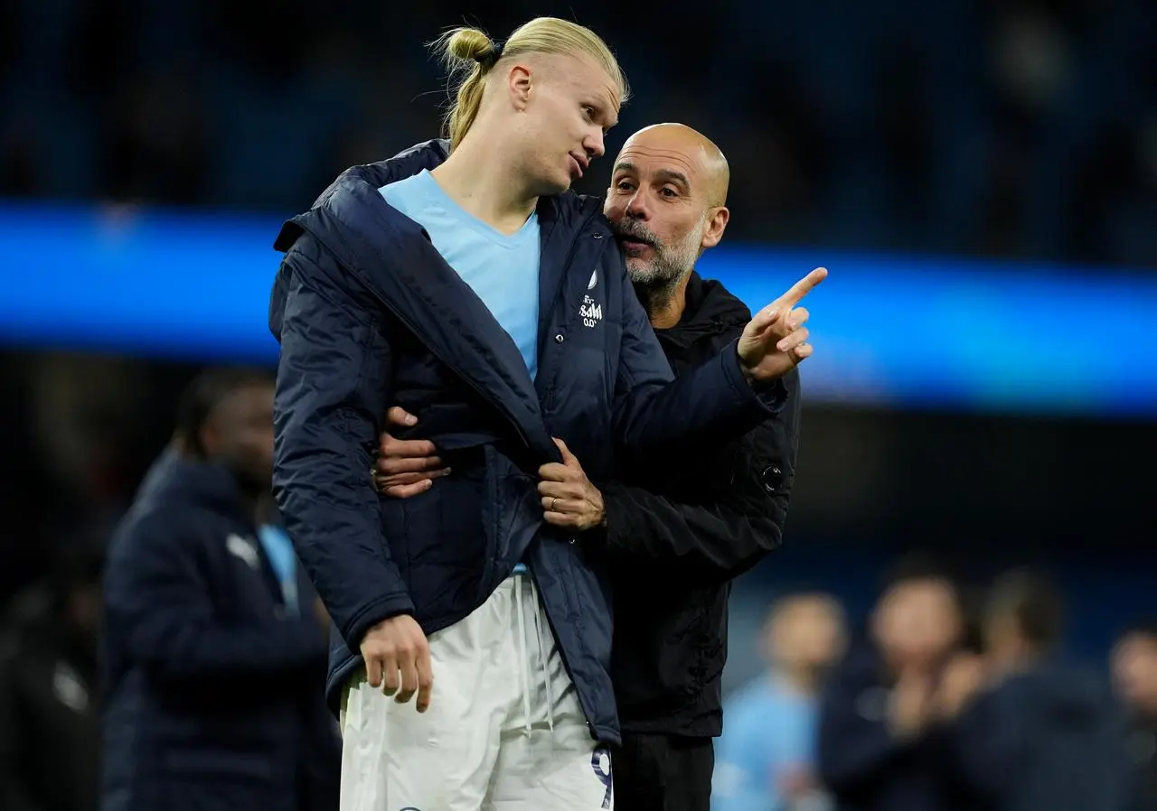 Pep Guardiola speaks with Erling Haaland after the final whistle