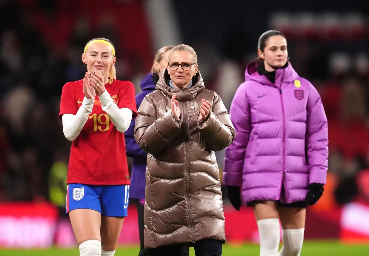 Sarina Wiegman applauds the fans after England's win 