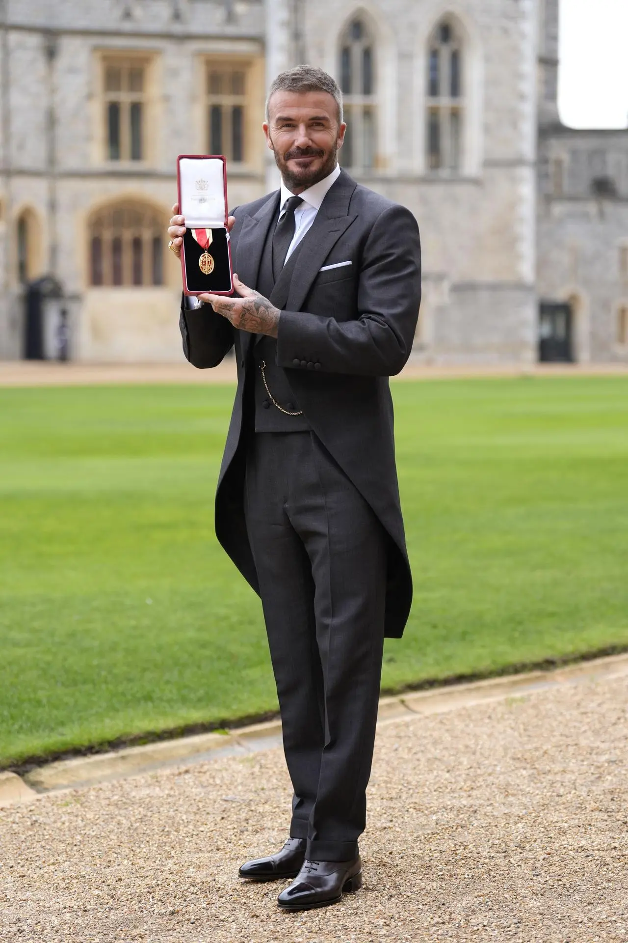 Sir David Beckham after he was made a Knight Bachelor at an investiture ceremony at Windsor Castle, Berkshire