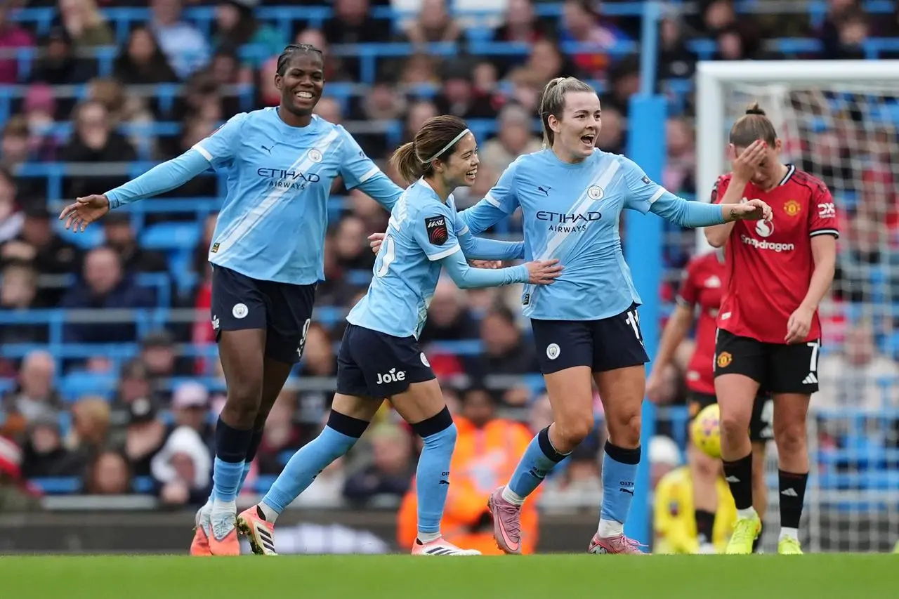 Lauren Hemp celebrates scoring against Manchester United