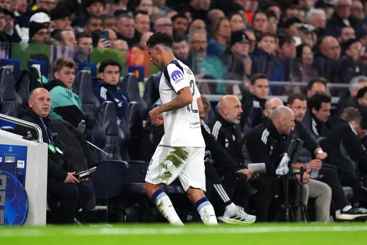 Tottenham’s Brennan Johnson leaves the pitch after being shown a red card
