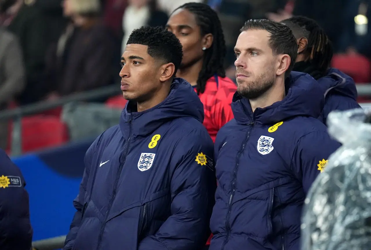England’s Jude Bellingham (left) and Jordan Henderson on the bench