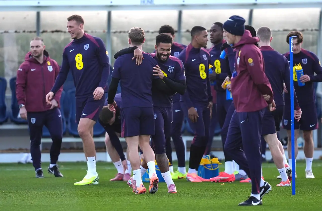 England’s Reece James (centre, facing) with team-mates as head coach Thomas Tuchel looks on 