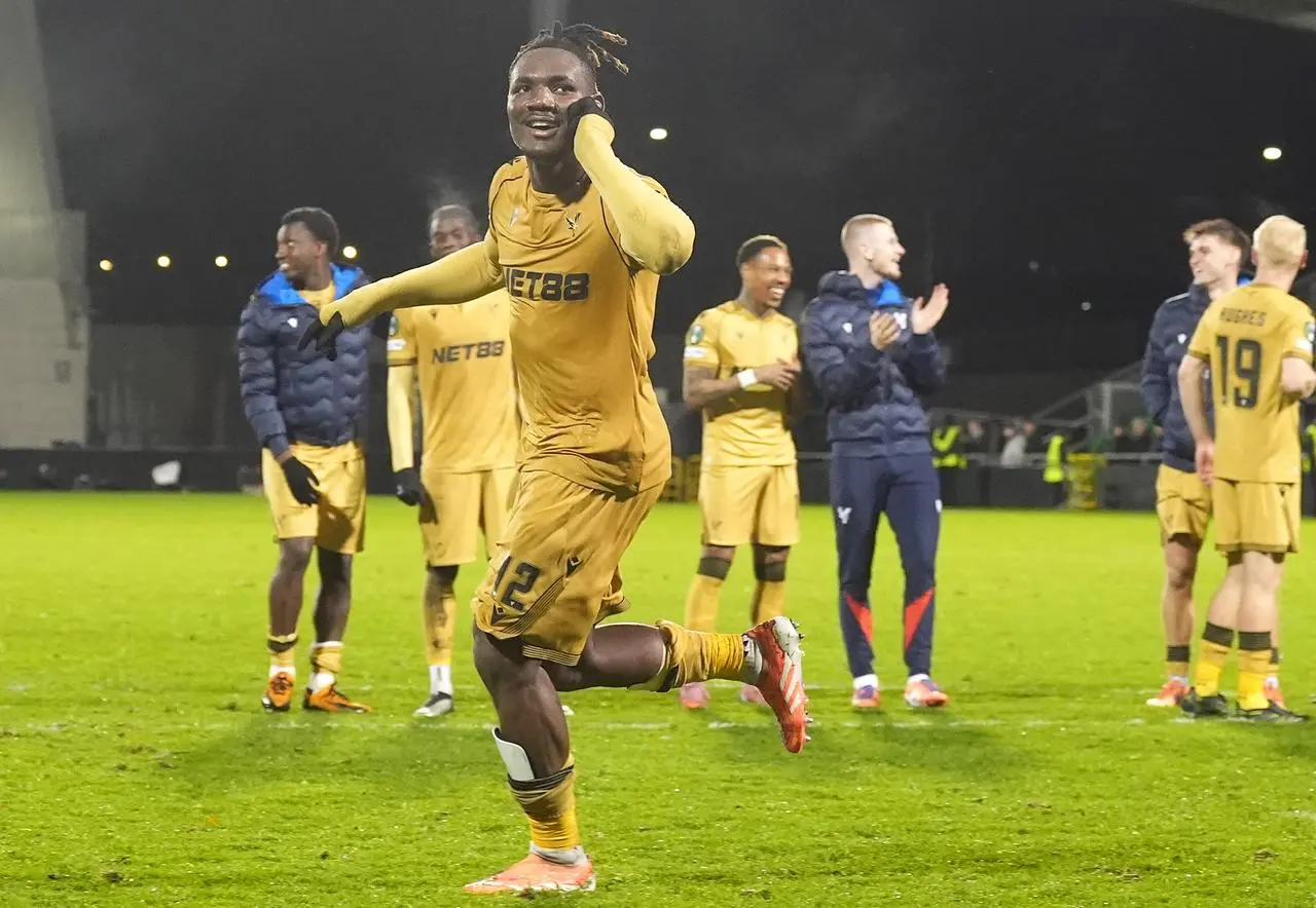 Crystal Palace’s Christantus Uche celebrates in front of the fans following victory in the Conference League match against Shelbourne at the Tallaght Stadium in Dublin