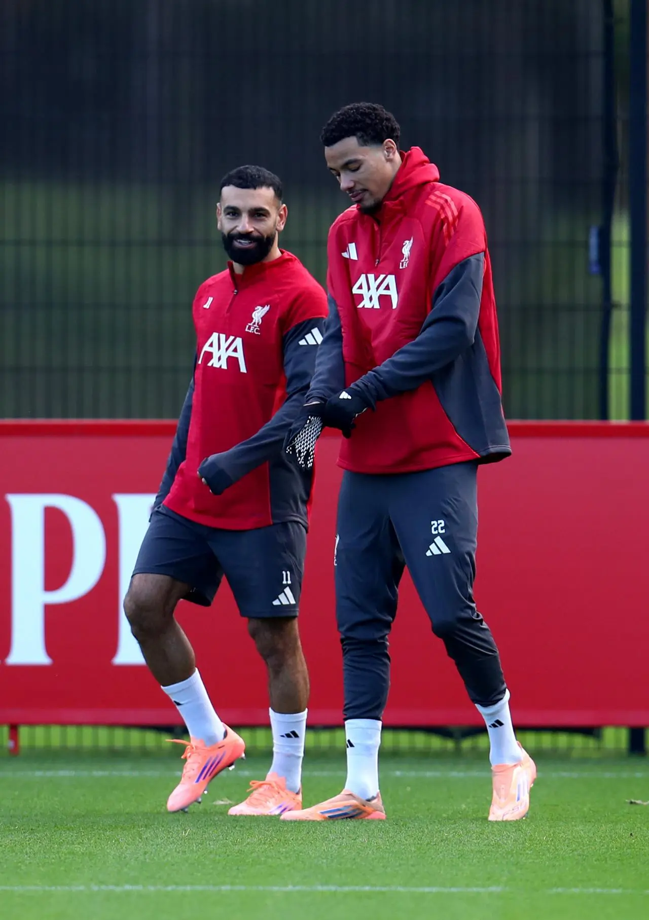 Mohamed Salah (right) and Hugo Ekitike chatted before Monday's training session