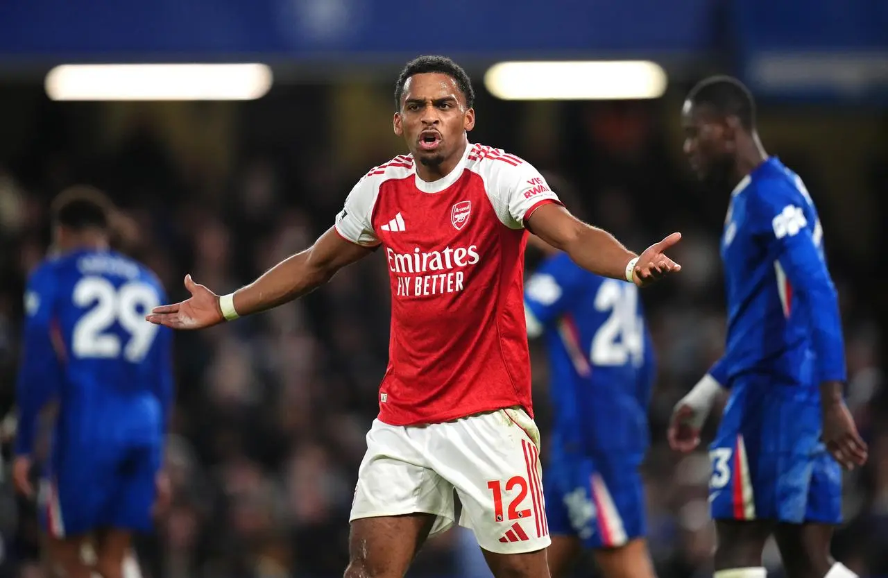 Arsenal’s Jurrien Timber spreads his arms to appeal to the assistant referee