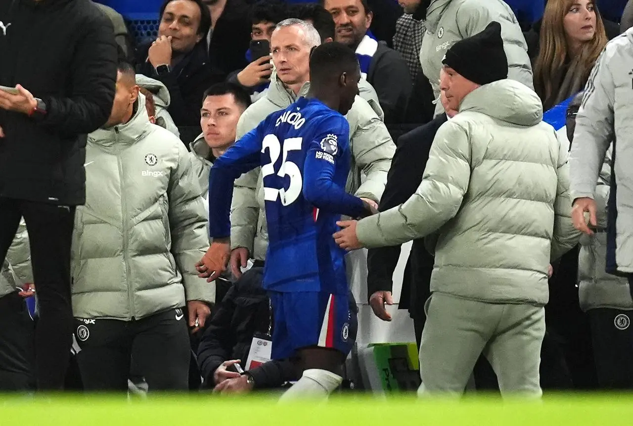 Chelsea’s Moises Caicedo walks off the field after being sent off against Arsenal