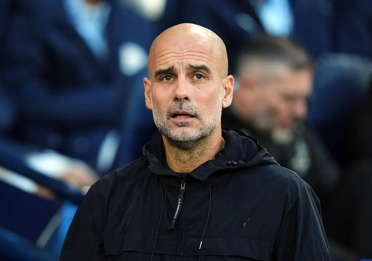 Pep Guardiola in Manchester City's dugout