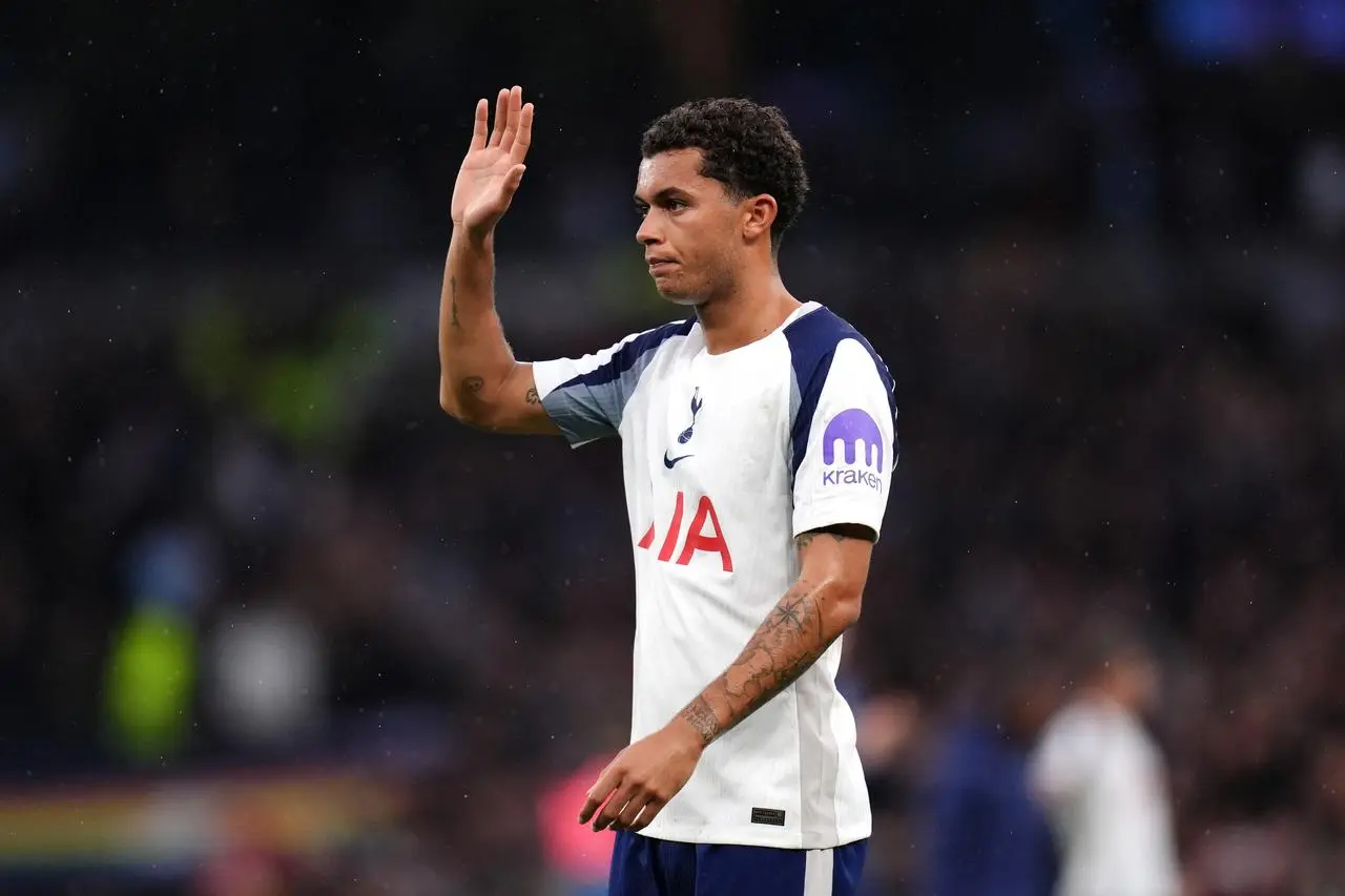 Tottenham’s Brennan Johnson salutes the fans following a Premier League match against Aston Villa