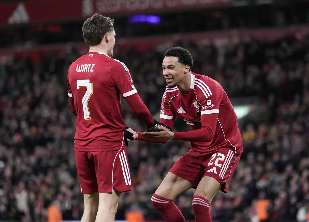 Hugo Ekitike, right, celebrate with Florian Wirtz