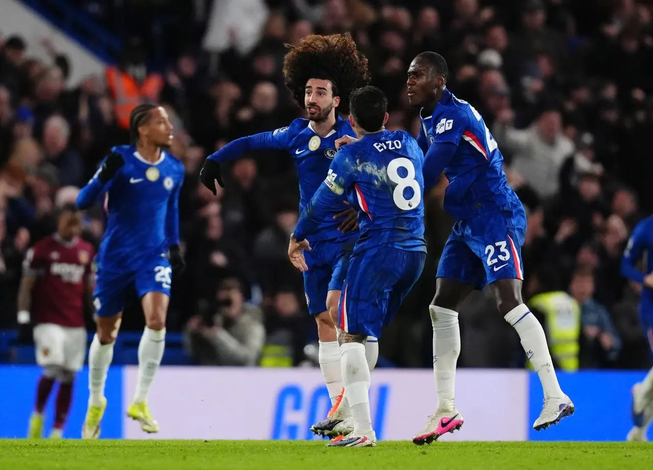 Marc Cucurella, second left, celebrates his equaliser