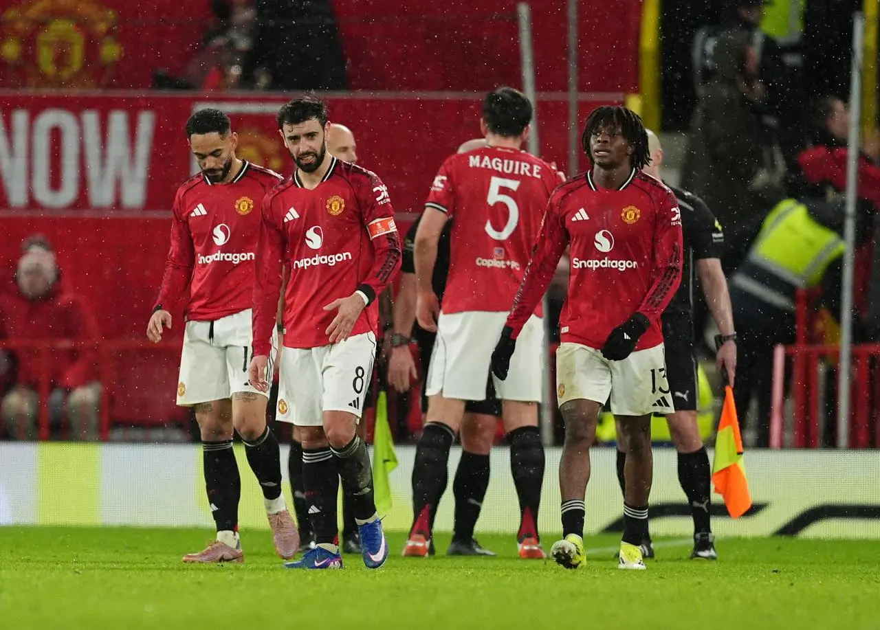 Manchester United players appear dejected at the final whistle