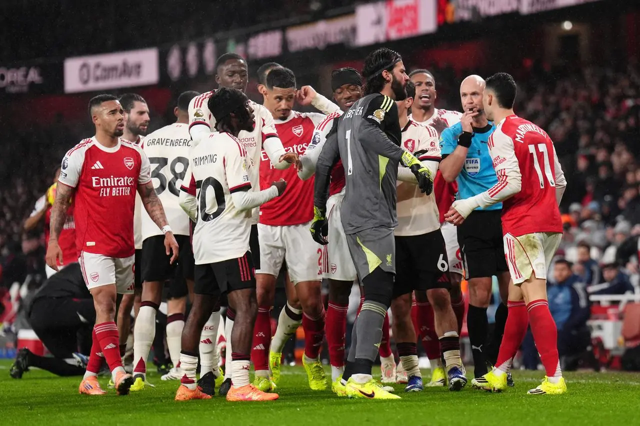 Arsenal and Liverpool players clash