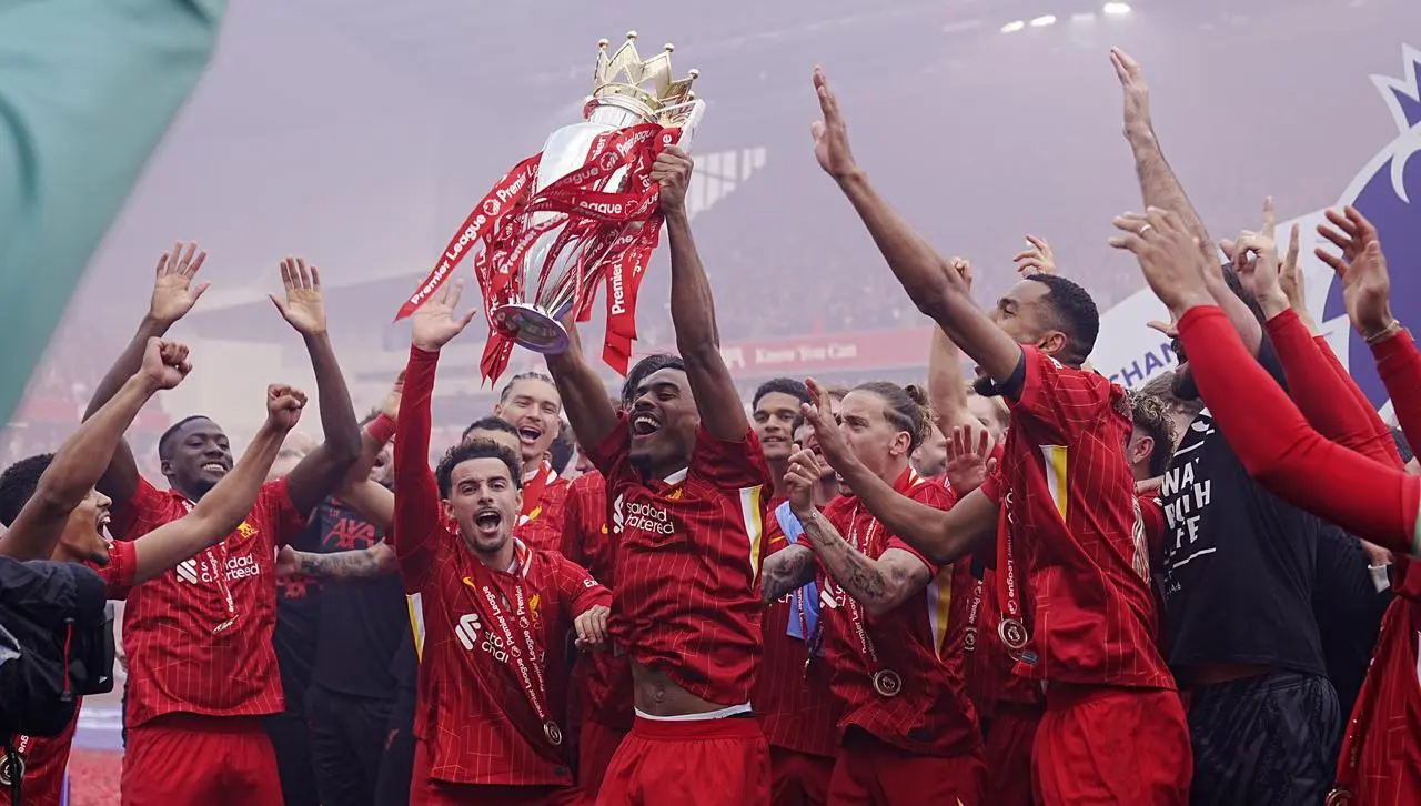 Liverpool players celebrate with the Premier League trophy following their match against Crystal Palace in May 2025