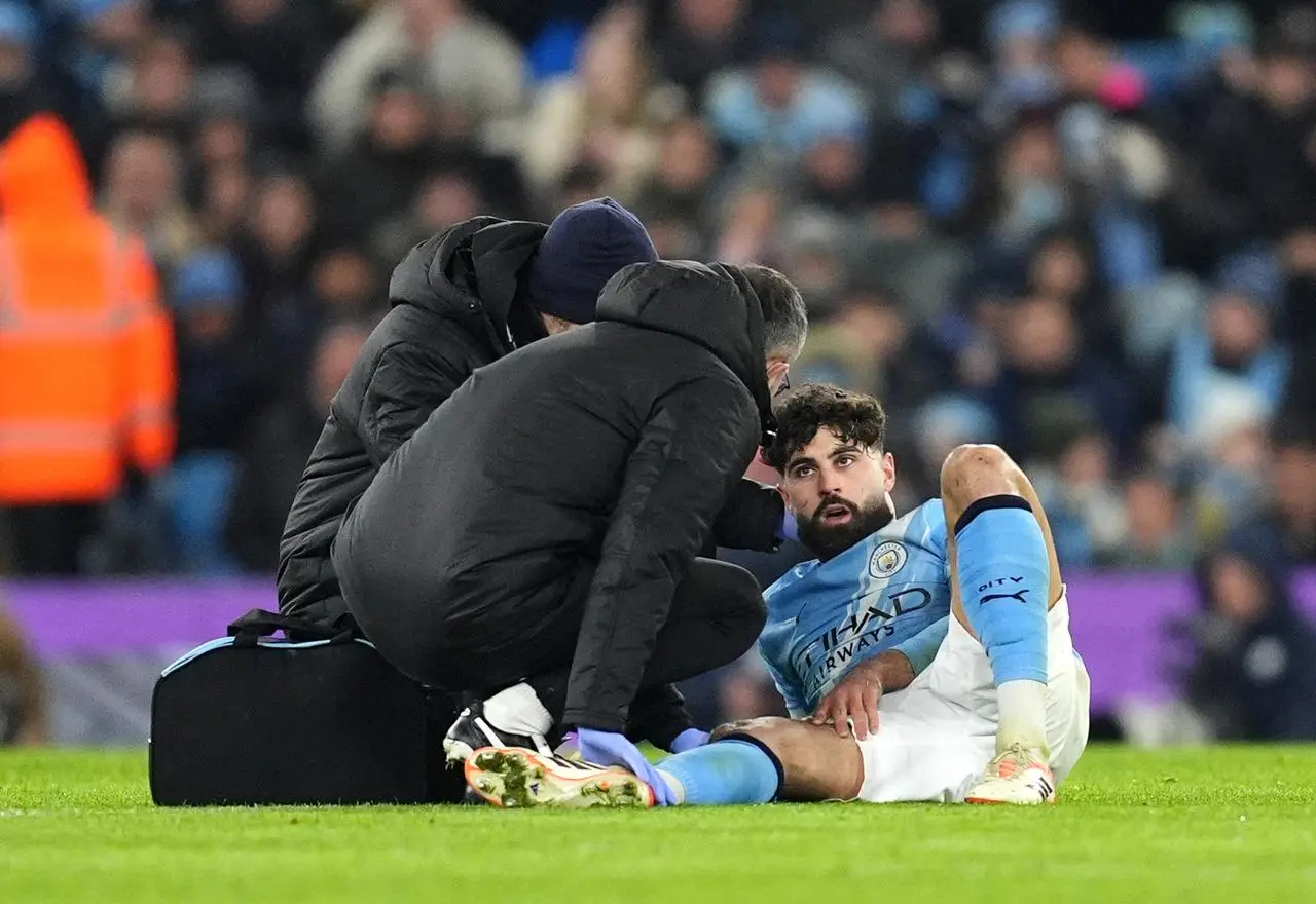 Manchester City’s Josko Gvardiol receives teatment for an injury during a game