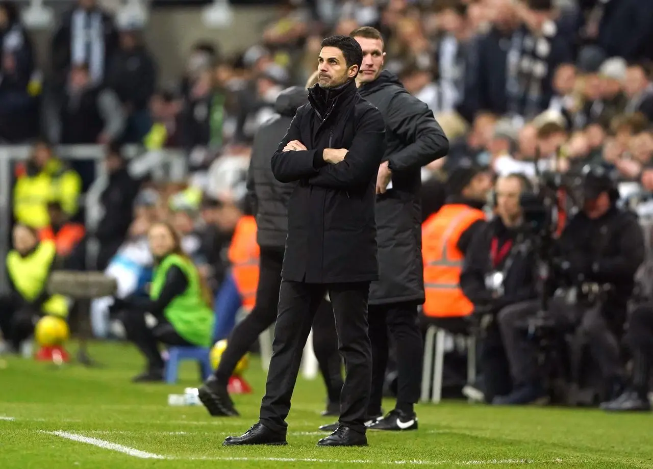 Mikel Arteta stands with arms folded