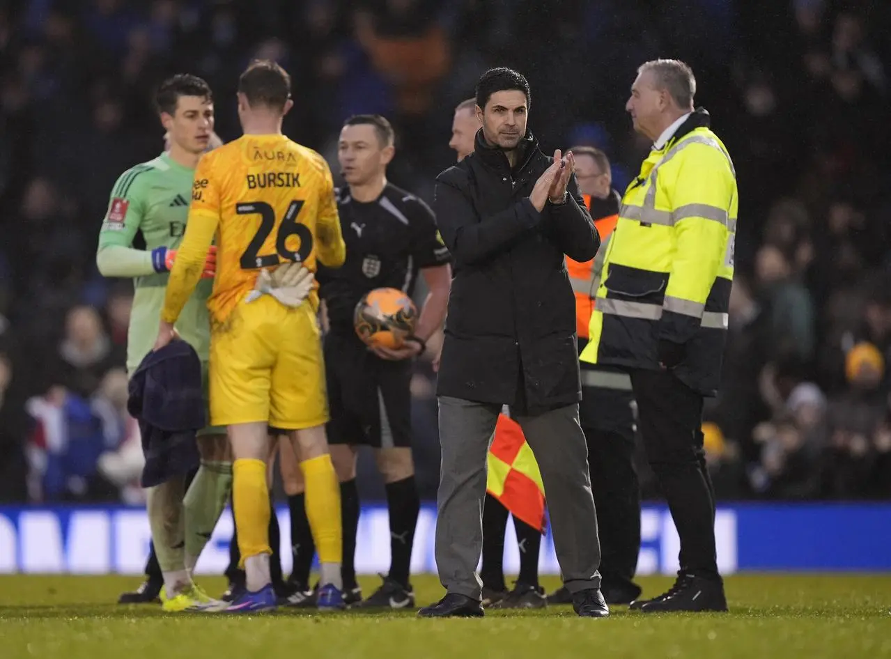 Mikel Arteta applauds the Arsenal fans after victory over Portsmouth 