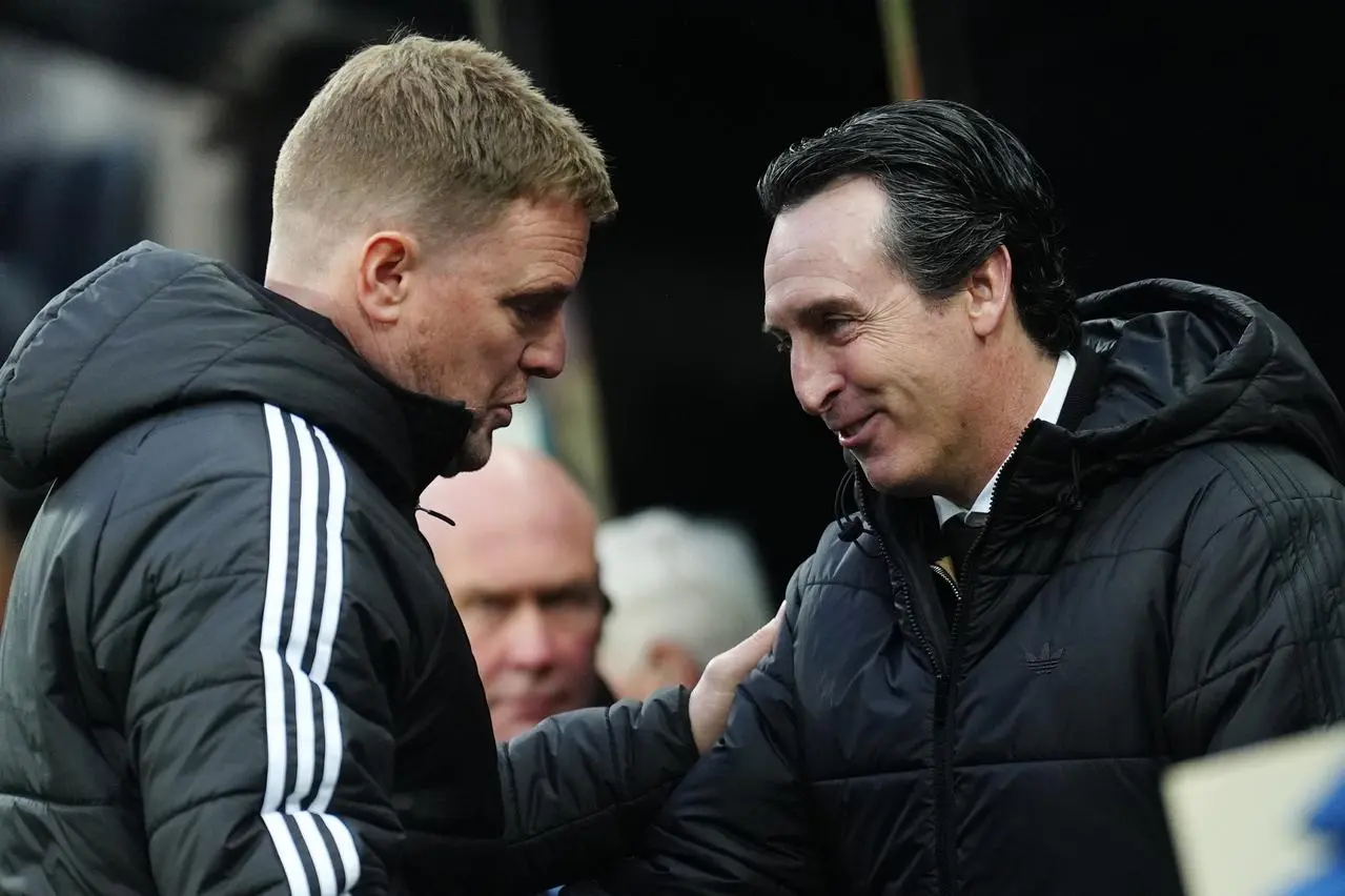 Eddie Howe, left, and Unai Emery shake hands