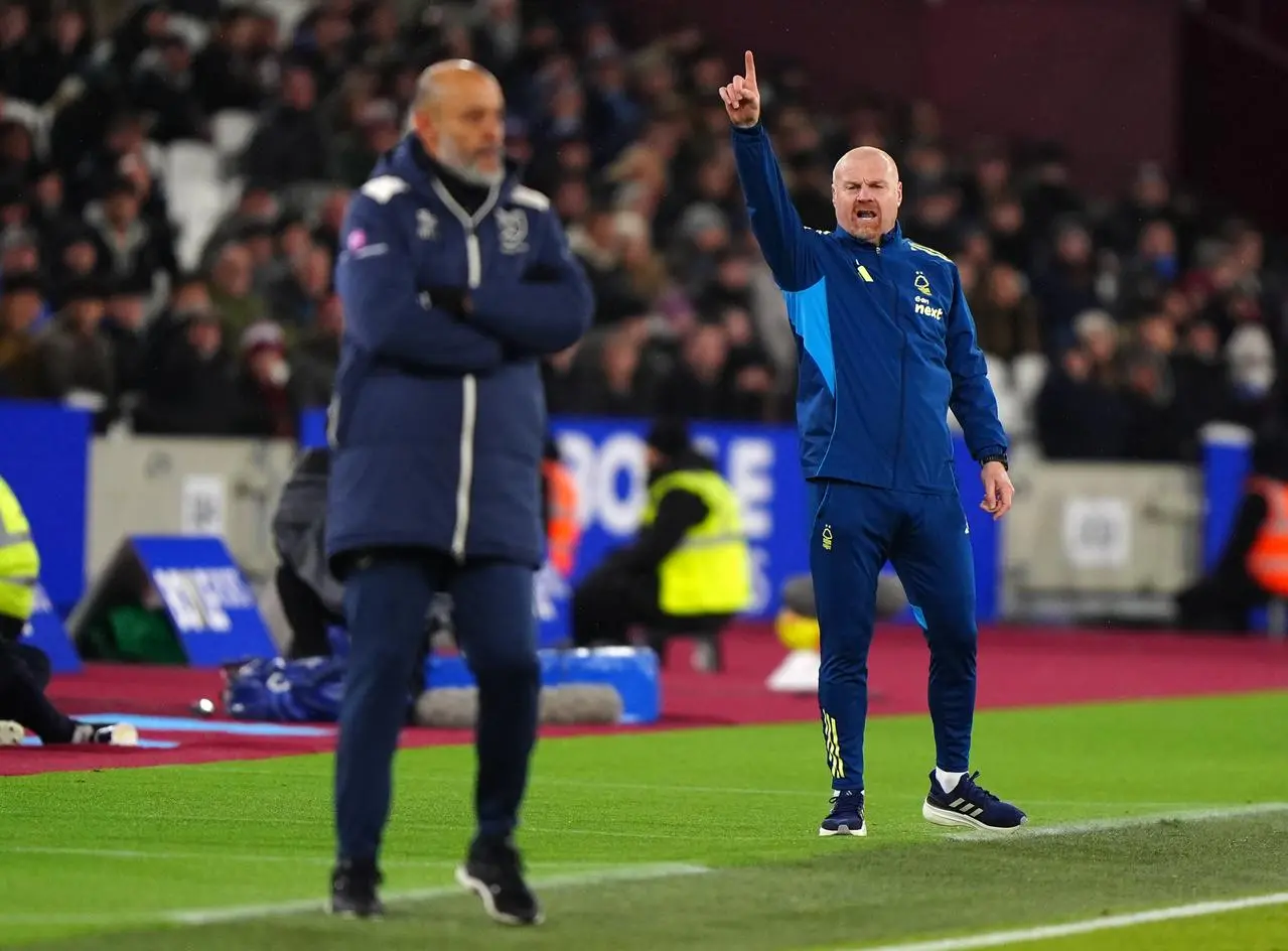 Nottingham Forest manager Sean Dyche, right, points upwards with West Ham boss Nuno Espirito Santo visible in the foreground