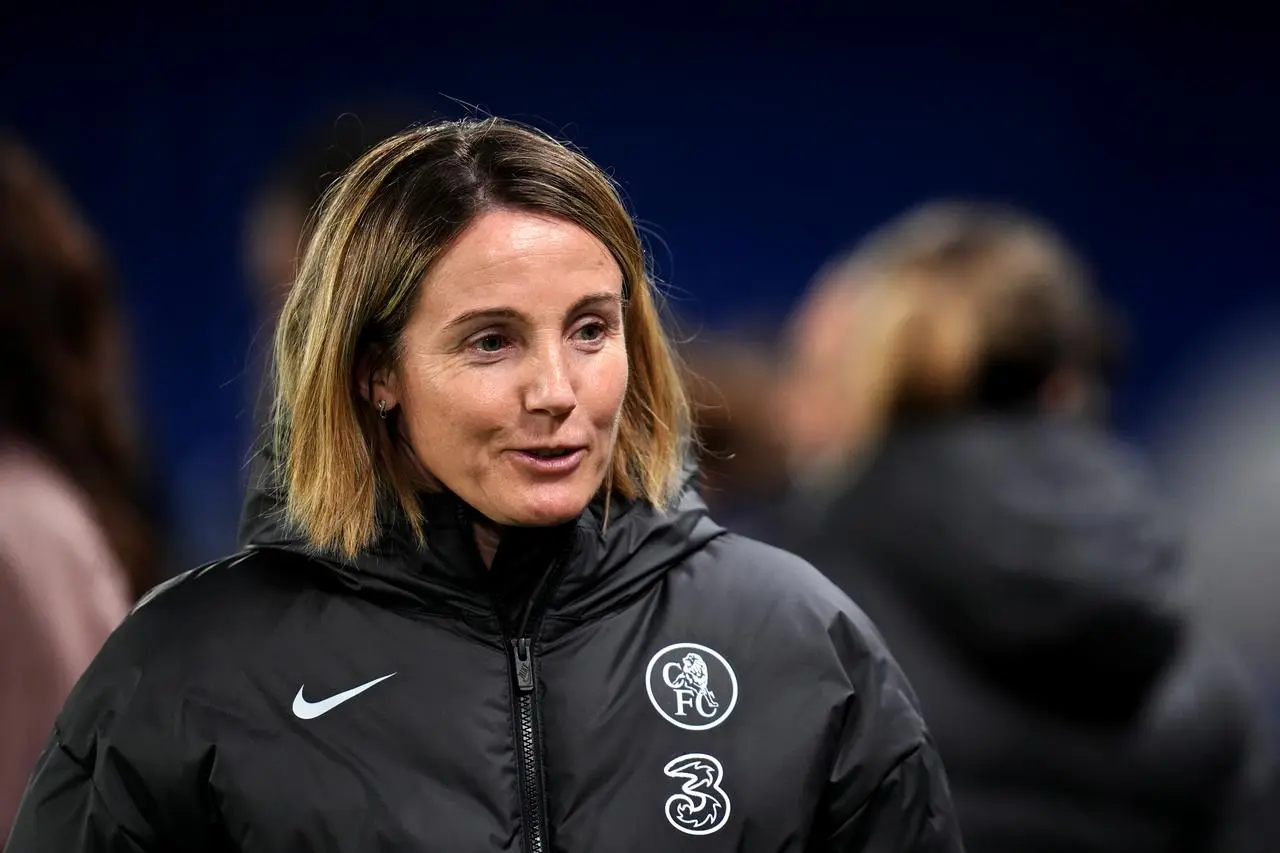 Sonia Bompastor looking to the side