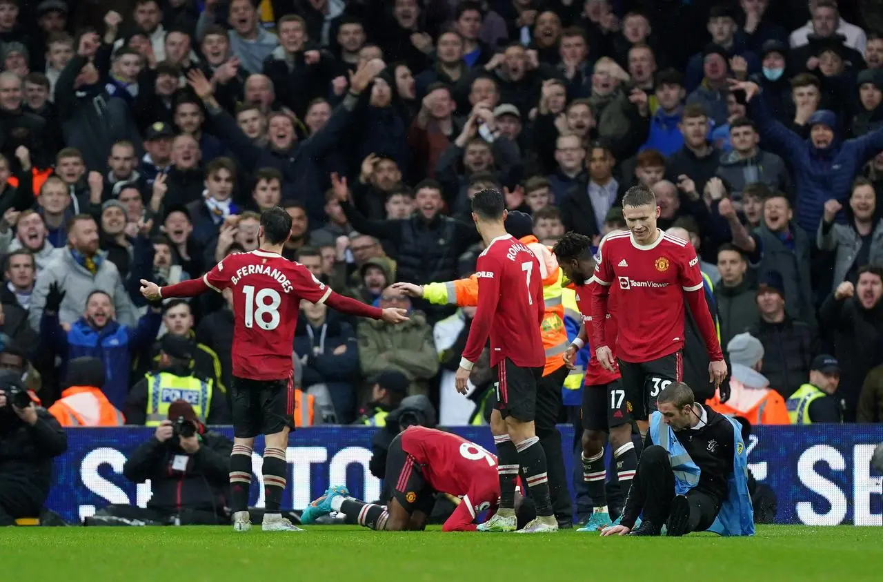 Manchester United’s Anthony Elanga (on floor, centre) after being struck by an object thrown from the crowd at Elland Road