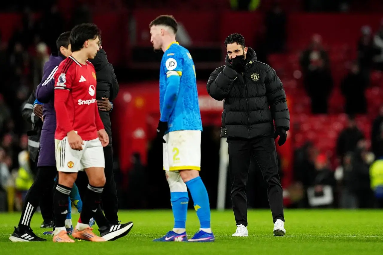 Manchester United manager Ruben Amorim, right, after the Premier League draw with Wolves