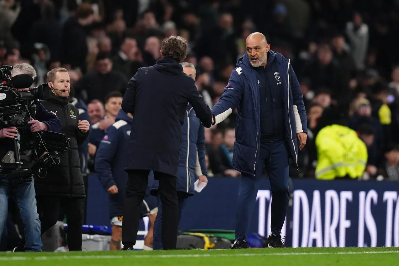 Nuno Espirito Santo (right) shakes hands with Thomas Frank