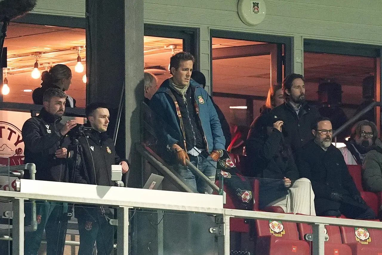 Ryan Reynolds watches on