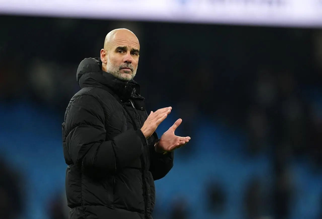 Manchester City manager Pep Guardiola applauds fans