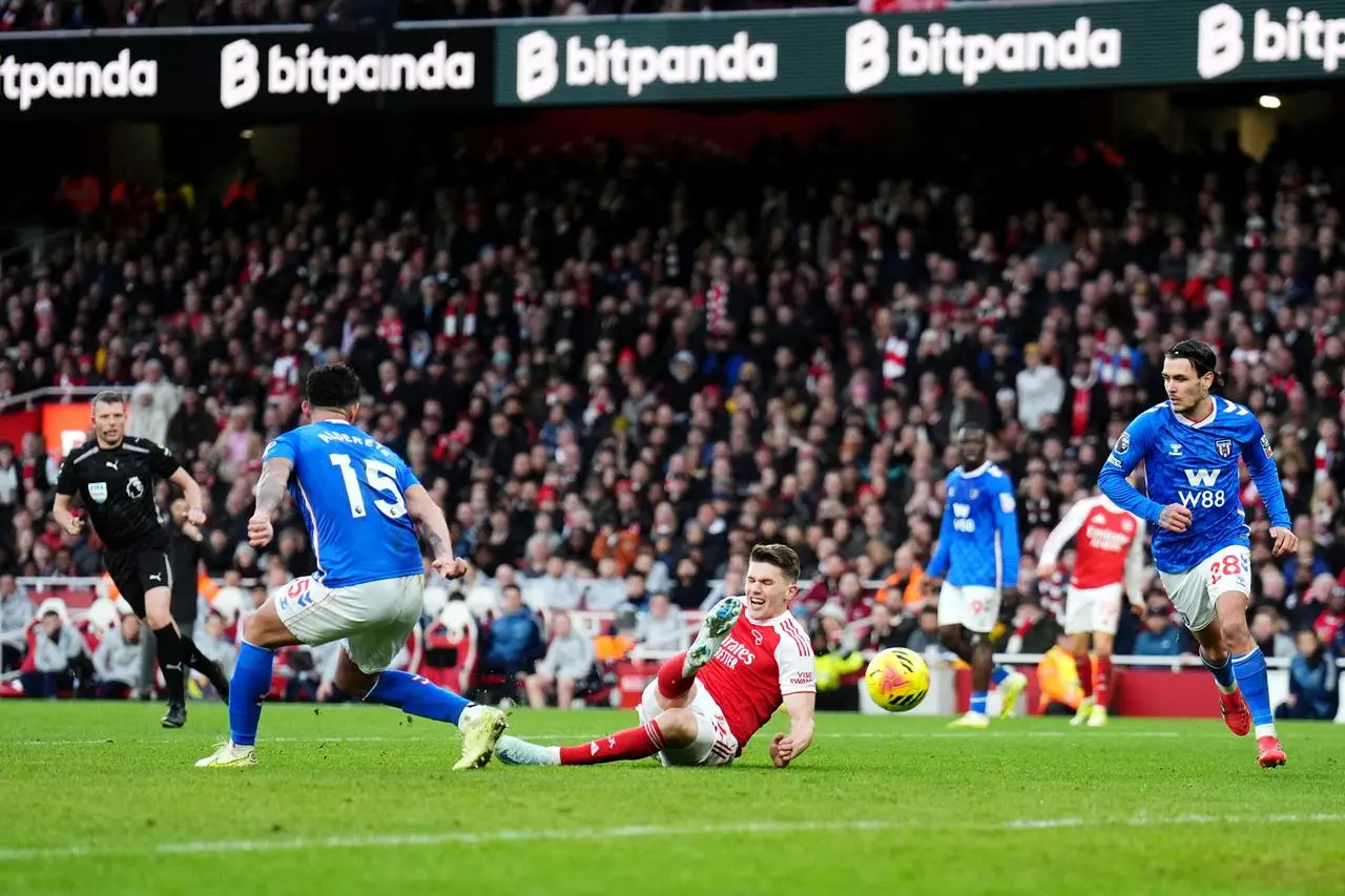 Viktor Gyokeres, centre, scores Arsenal’s second goal against Sunderland despite slipping to the ground