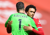 Alisson Becker embraces Trent Alexander-Arnold 