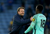 Brighton's assistant coach Bjorn Hamberg congratulates Danny Welbeck at the final whistle