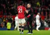 Edinson Cavani and Ralf Rangnick chat at the end of a game