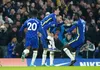 Mason Mount jumps on the back of Hakim Ziyech after he scored the opener against Tottenham