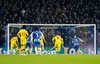 Crystal Palace goalkeeper Jack Butland makes a penalty save from Brighton's Pascal Gross