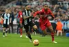 Watford striker Joao Pedro battles with Newcastle centre-half Jamaal Lascelles