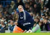 Marcelo Bielsa in his familiar crouching pose on the touchline