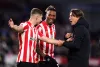 Thomas Frank laughs with his Brentford players