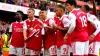 Gabriel Martinelli (centre) holds up team-mate Pablo Mari’s shirt (John Walton/PA)