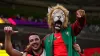 Morocco fans celebrate their shock victory over Belgium at the World Cup (Nick Potts/PA)