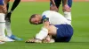 England’s Harry Kane holds his ankle. 