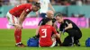 Wales defender Neco Williams receives treatment before leaving the pitch with a head injury against England (Martin Rickett/