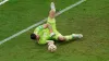 Emiliano Martinez saves from France’s Kingsley Coman in the World Cup final penalty shoot-out (Martin Rickett/PA)