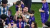 Argentina’s Lionel Messi sits with family members after the World Cup final (Adam Davy/PA)