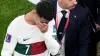 Cristiano Ronaldo leaves the field at the end of the World Cup quarter-final (Luca Bruno/AP)