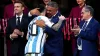 Argentina captain Lionel Messi hugs Claudio Tapia, president of the Argentina Football Association, after leading his side t