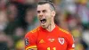 Gareth Bale celebrates World Cup qualification with Wales (David Davies/PA)