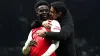 Arsenal’s Bukayo Saka (left) celebrates with manager Mikel Arteta following victory in the north London derby against Totten