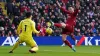 Chelsea goalkeeper Kepa Arrizabalaga saves at the feet of Liverpool’s Andrew Robertson (Martin Rickett/PA)