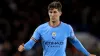 John Stones will miss the meeting with Manchester United (Bradley Collyer/PA).